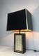 Large lamp in black lacquered wood, gilding and mother-of-pearl. French work. Circa 1970