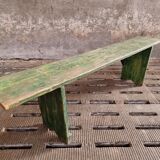 Old wooden bench side table grass green