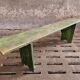 Old wooden bench side table grass green