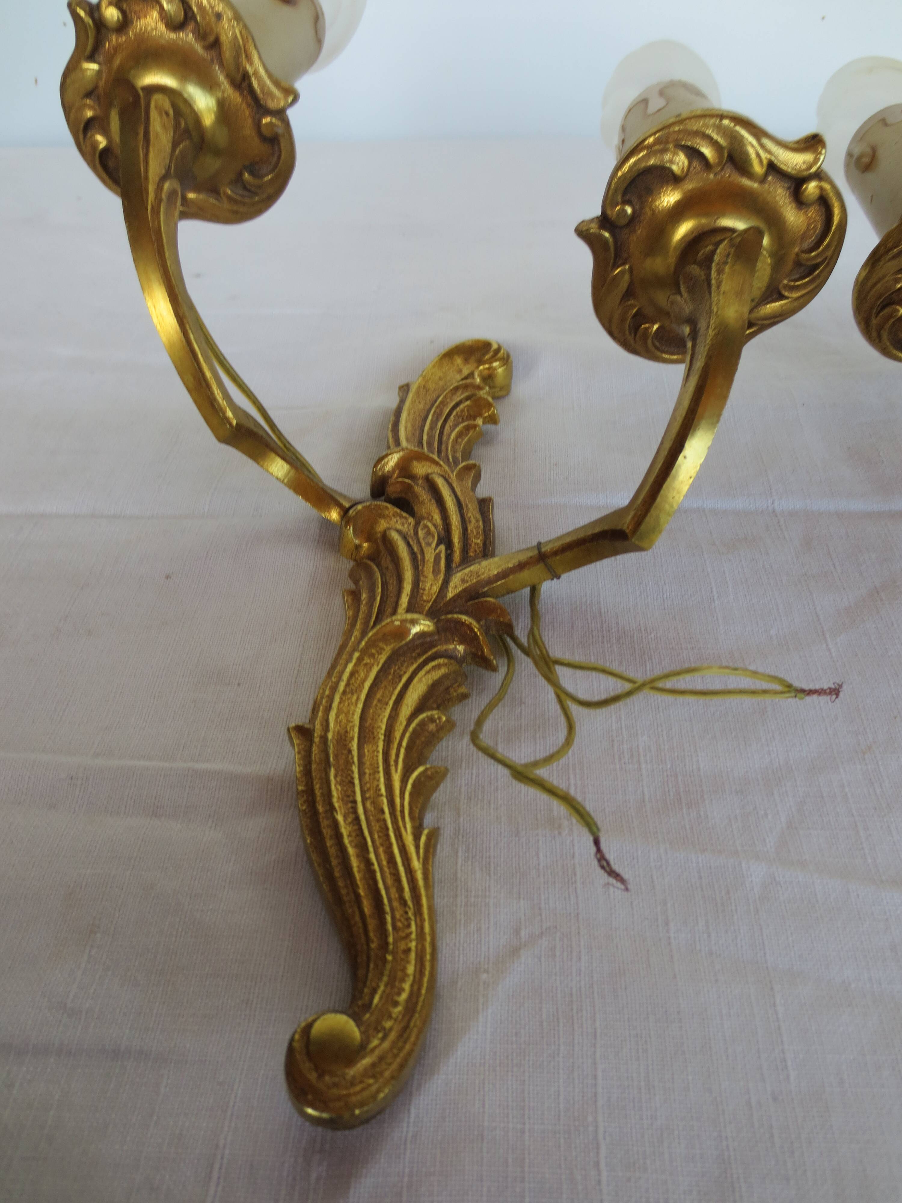 Pair of double wall lights in gilded bronze