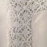 Old embroidered white linen and surnappe tablecloth