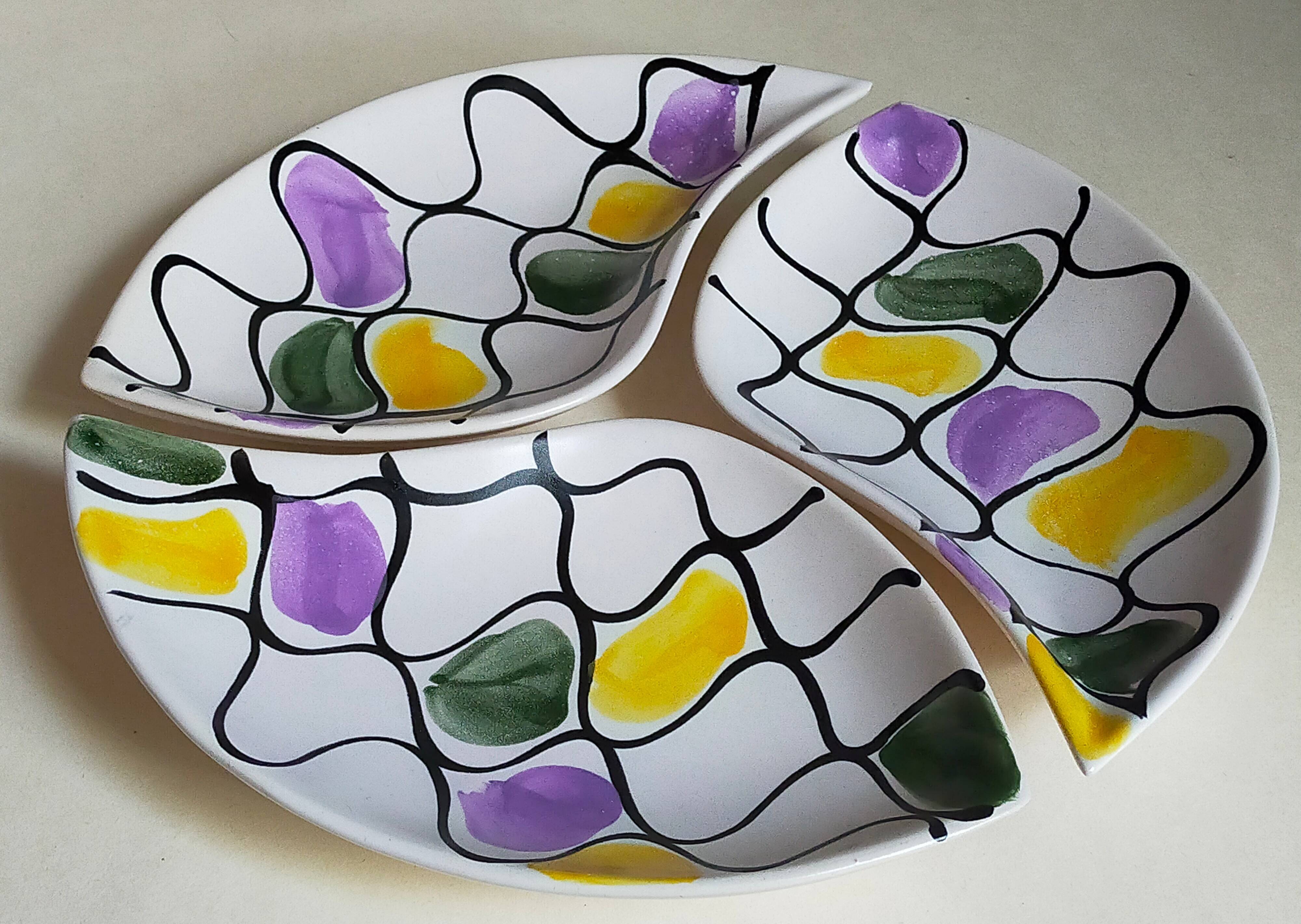Three vintage free-form ceramic ravine dishes from the 1950s