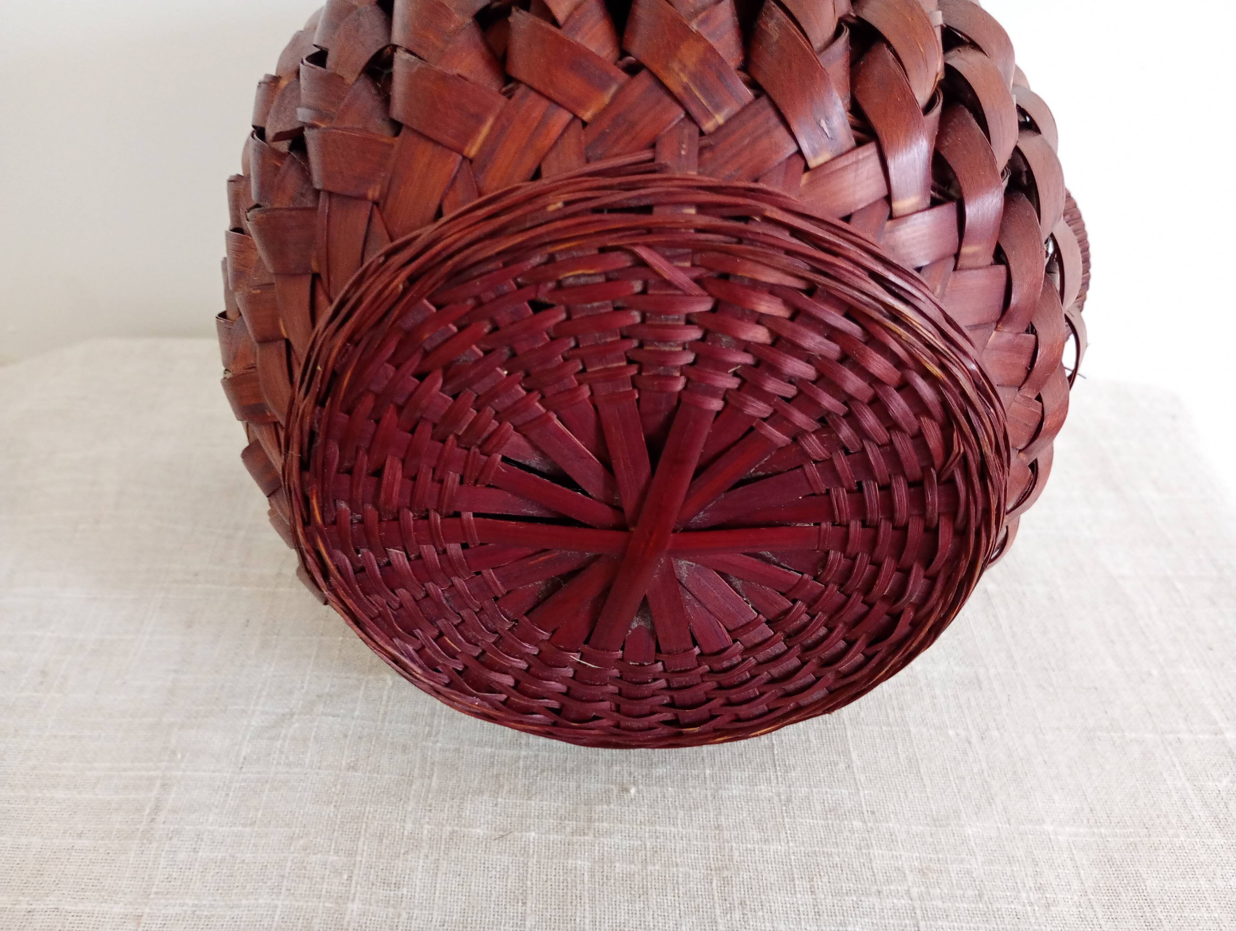 Japanese vase made of woven bamboo. Ikebana.