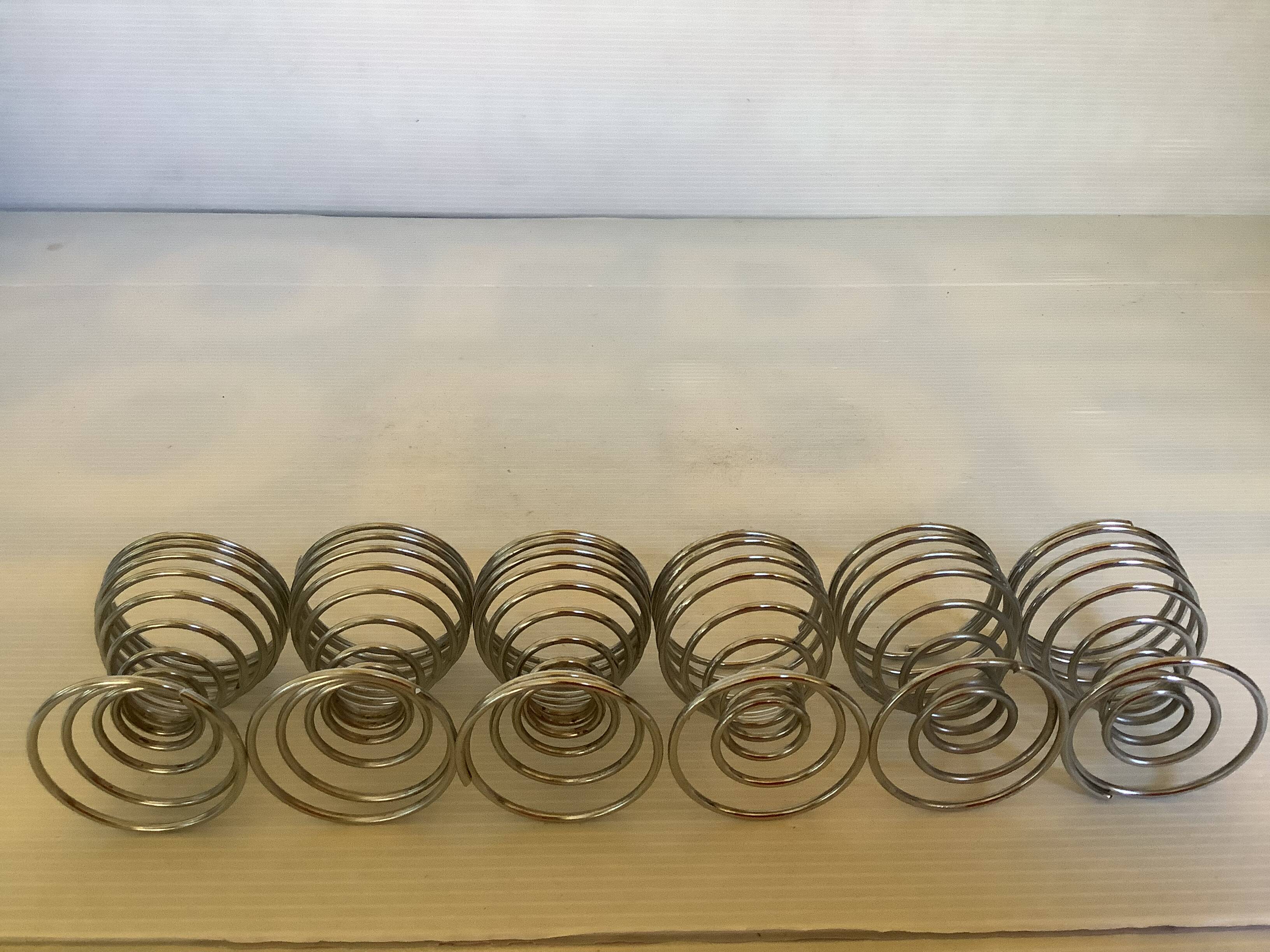 Six spiral spring egg cups