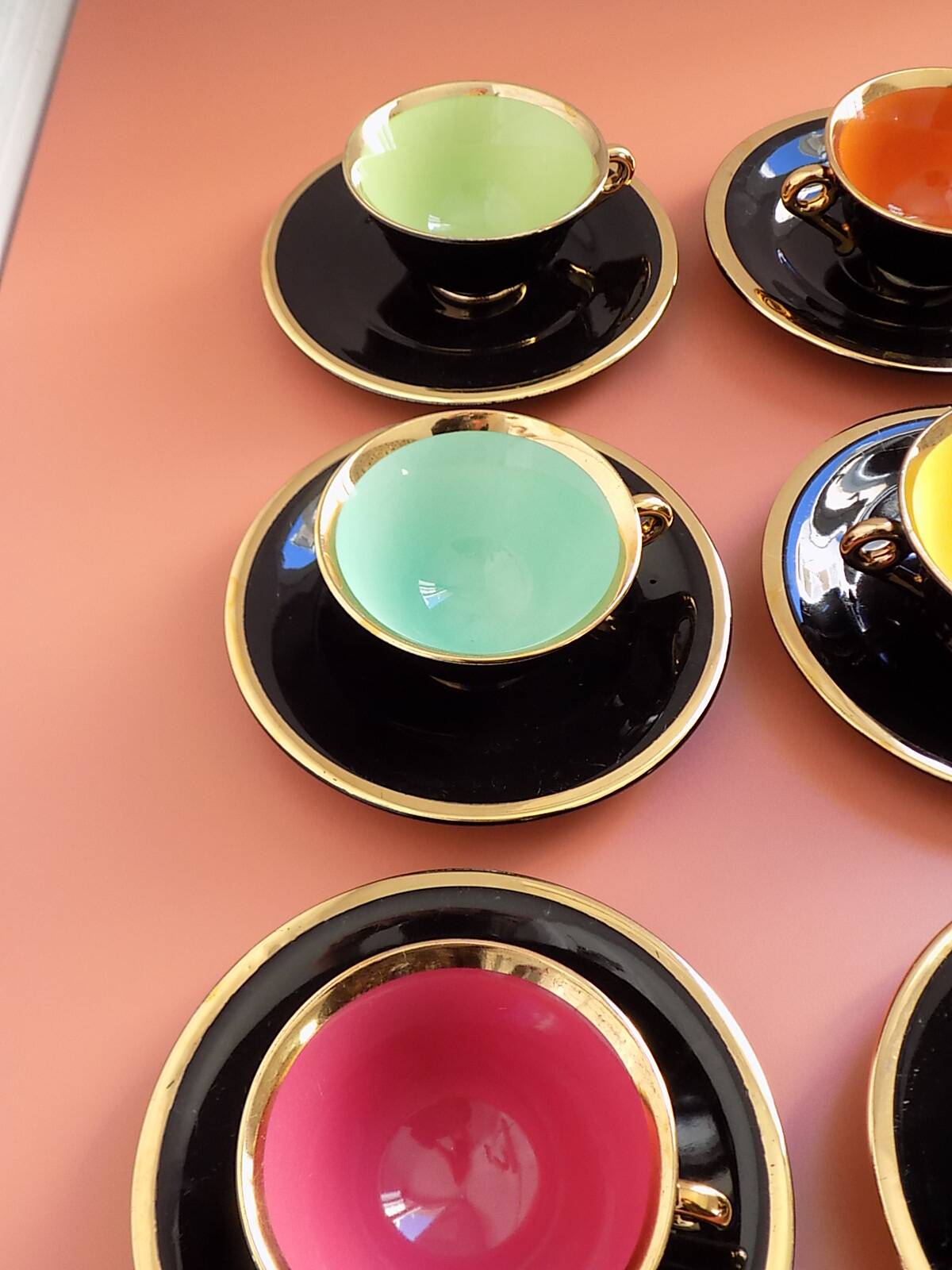 set of 9 black and gold Salins cups and saucers