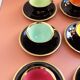 set of 9 black and gold Salins cups and saucers