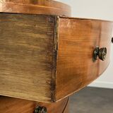English commode from the George III Regency period, bombe shape in mahogany veneer.