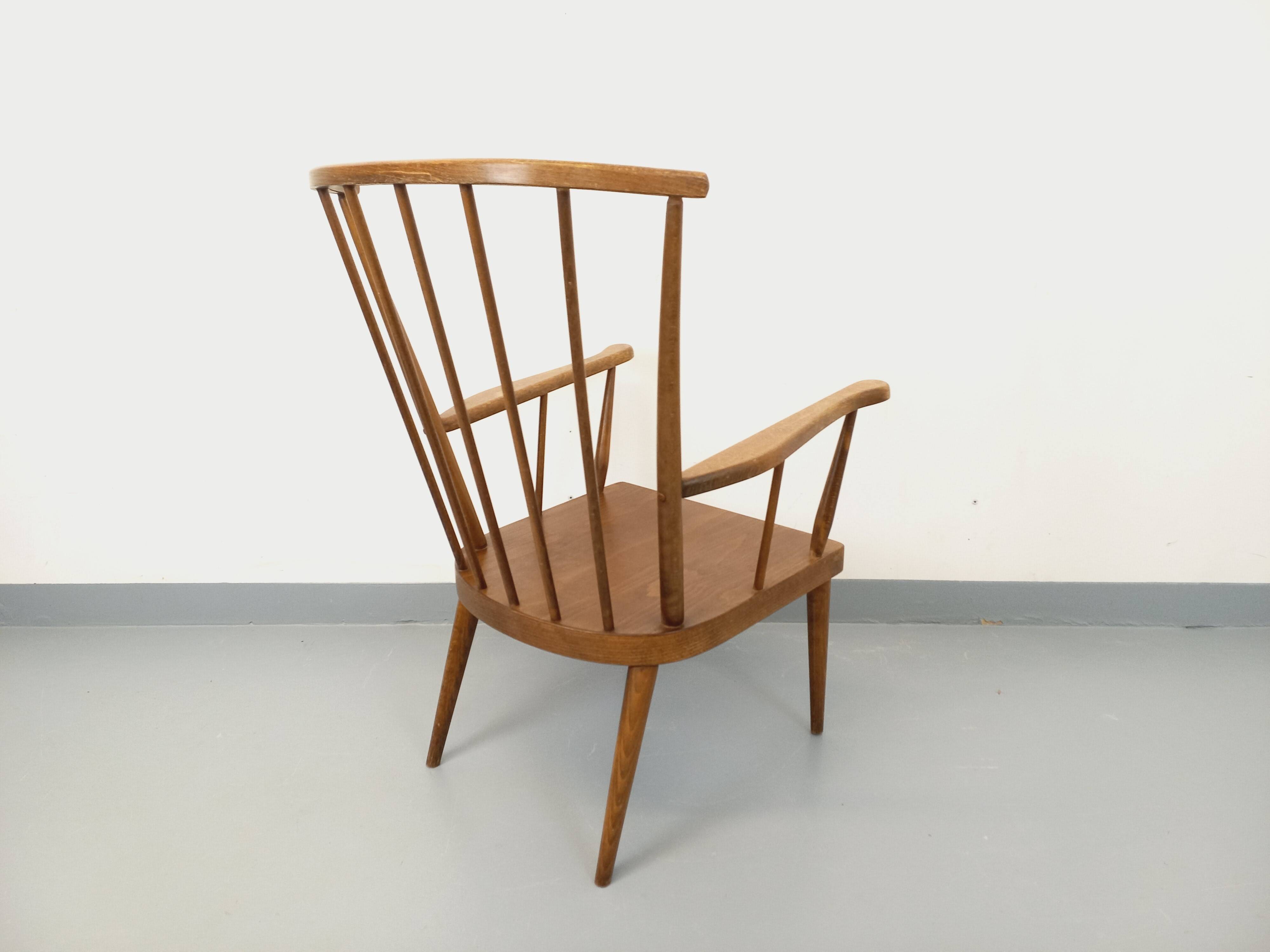 Vintage wooden armchair Baumann model Éventail from the 1960s.