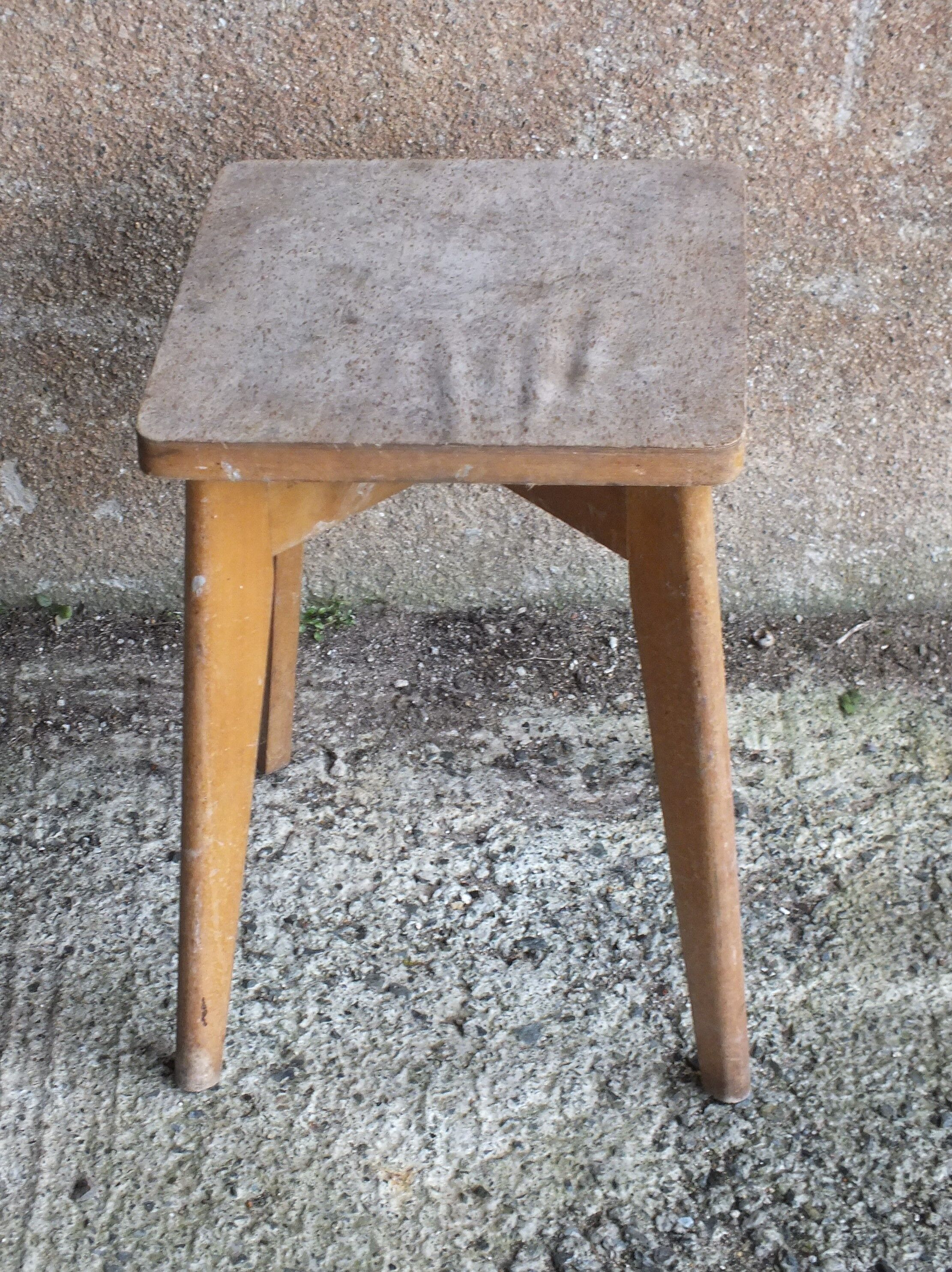 Vintage wooden stool with 4 legs from the 50s
