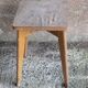 Vintage wooden stool with 4 legs from the 50s