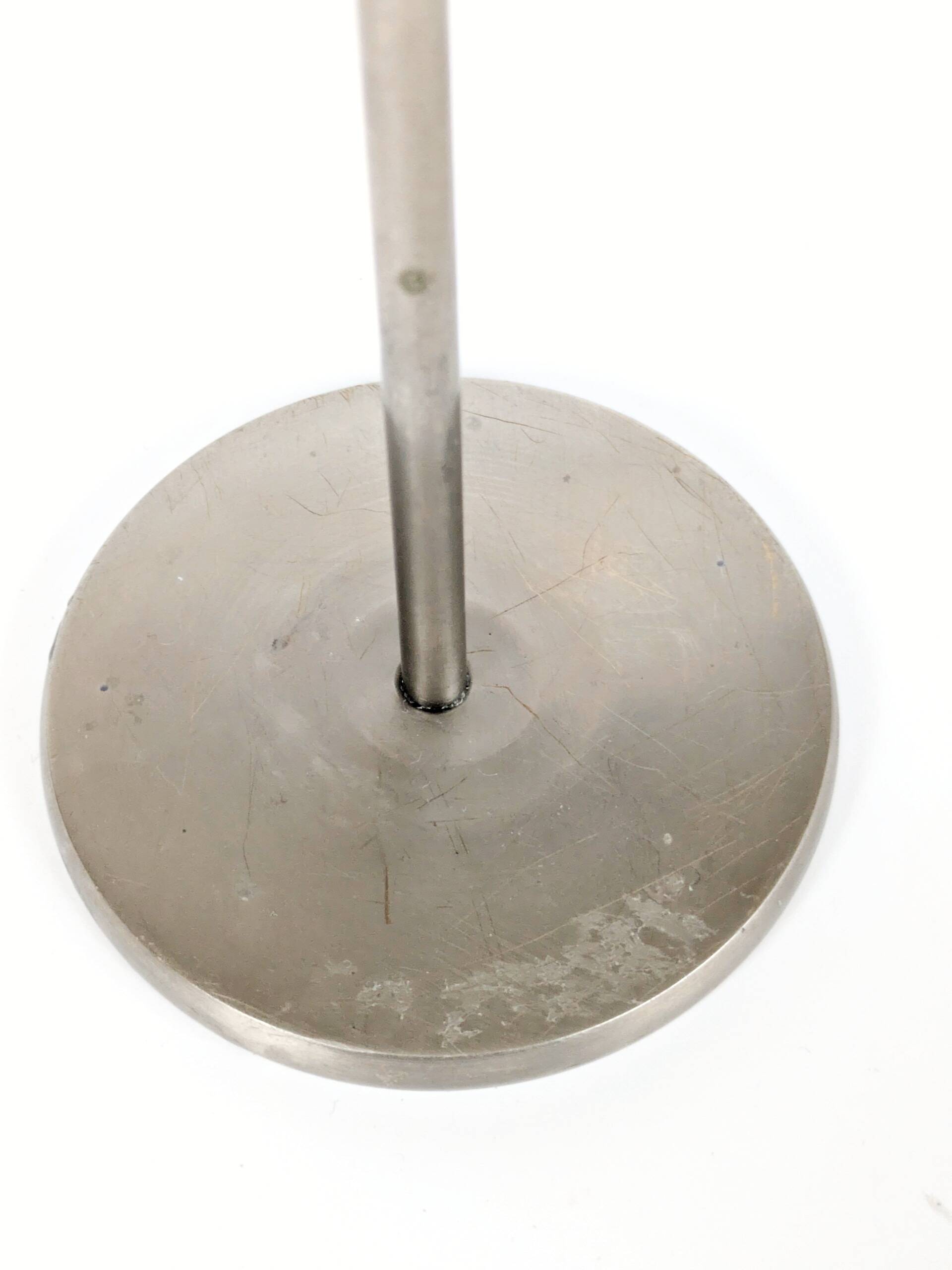 Pair of postmodern 1980s candlesticks, stainless steel and brass