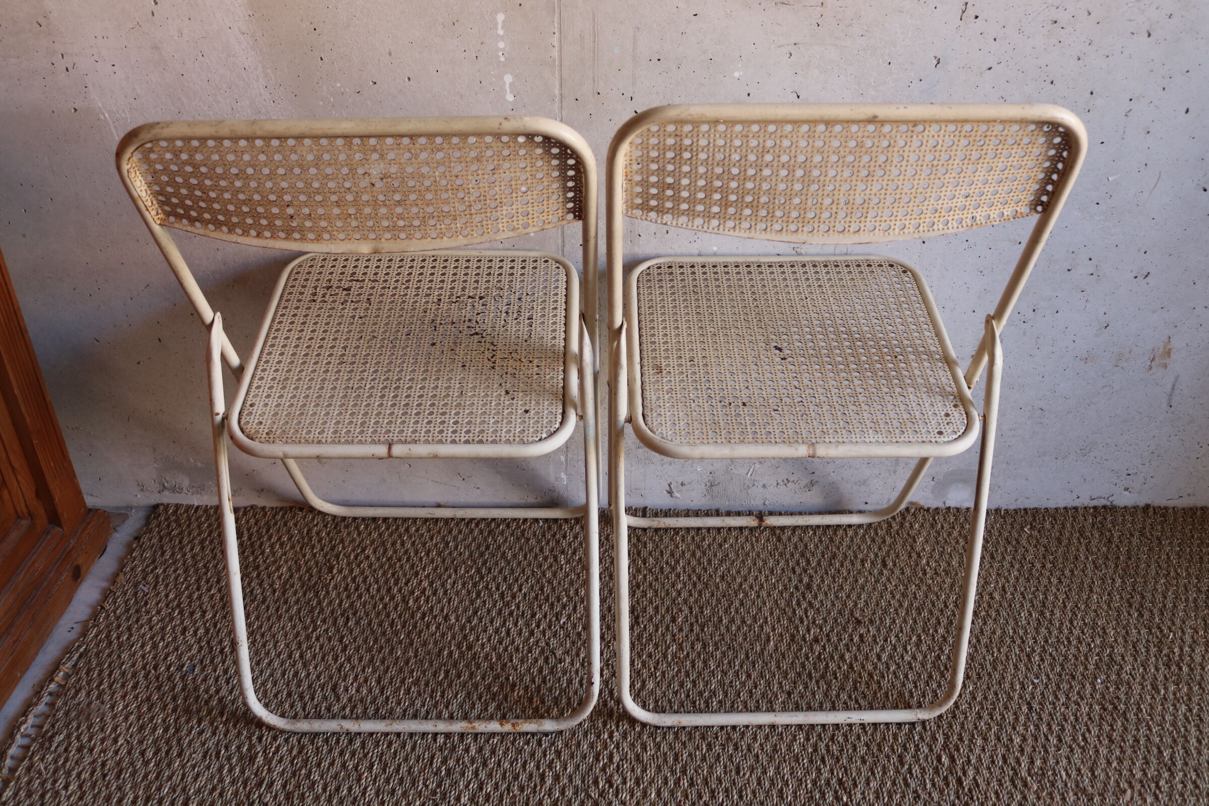 Two metal tanned folding chairs