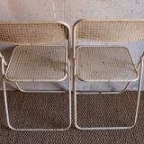 Two metal tanned folding chairs