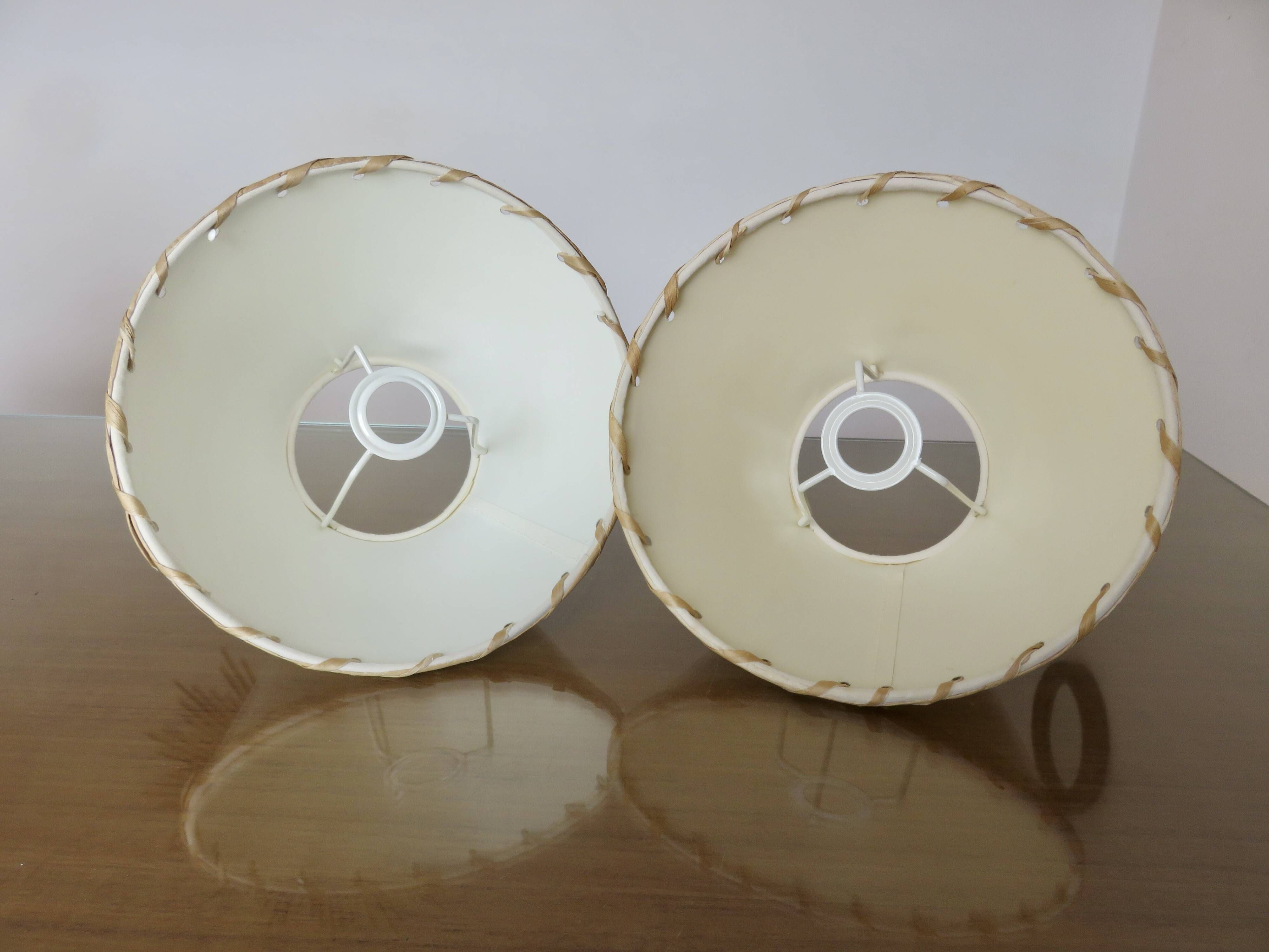 Pair of bedside lamps made of woven sea rush, matching lampshades, 1980.