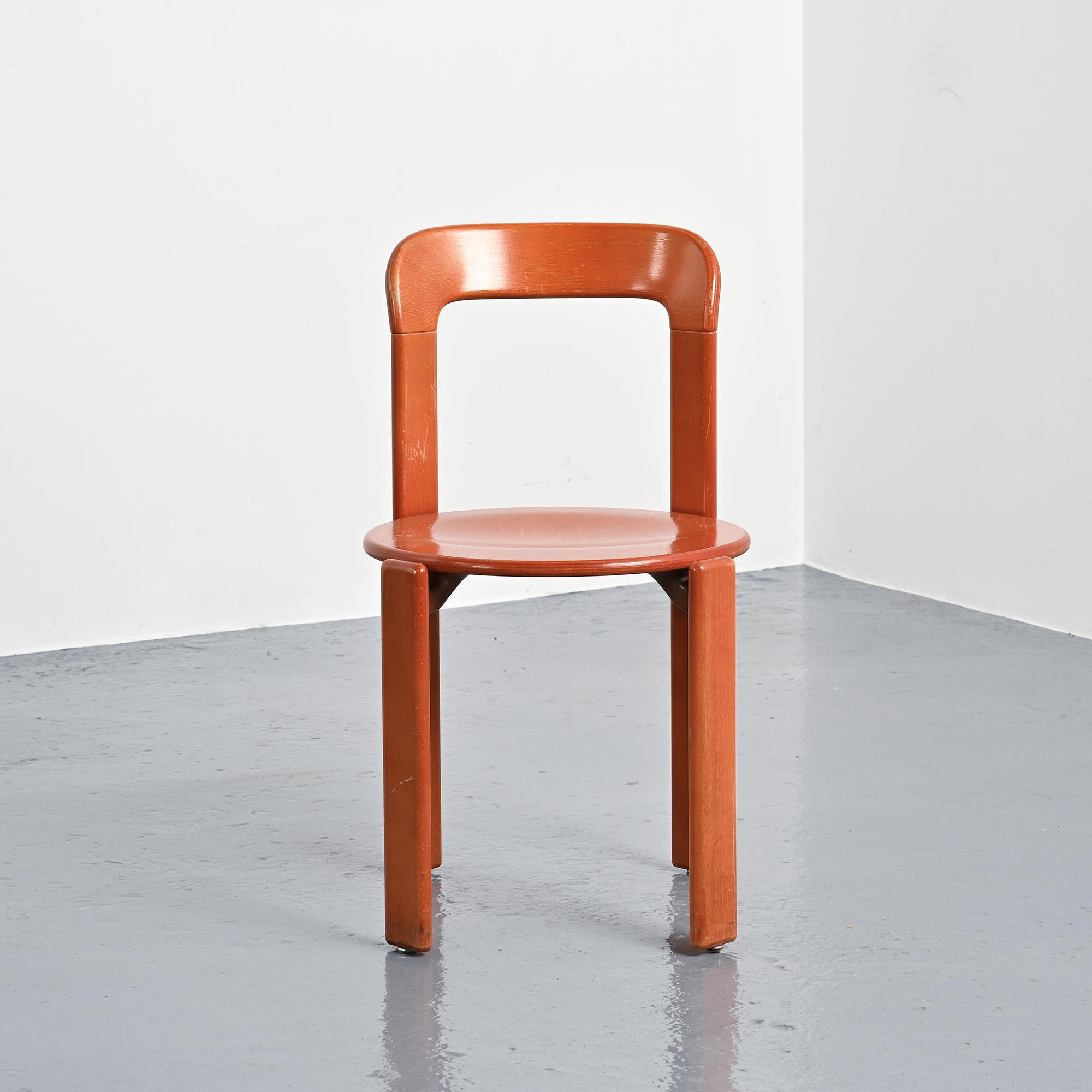Rey chairs in stained red beech by Bruno Rey