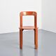 Rey chairs in stained red beech by Bruno Rey