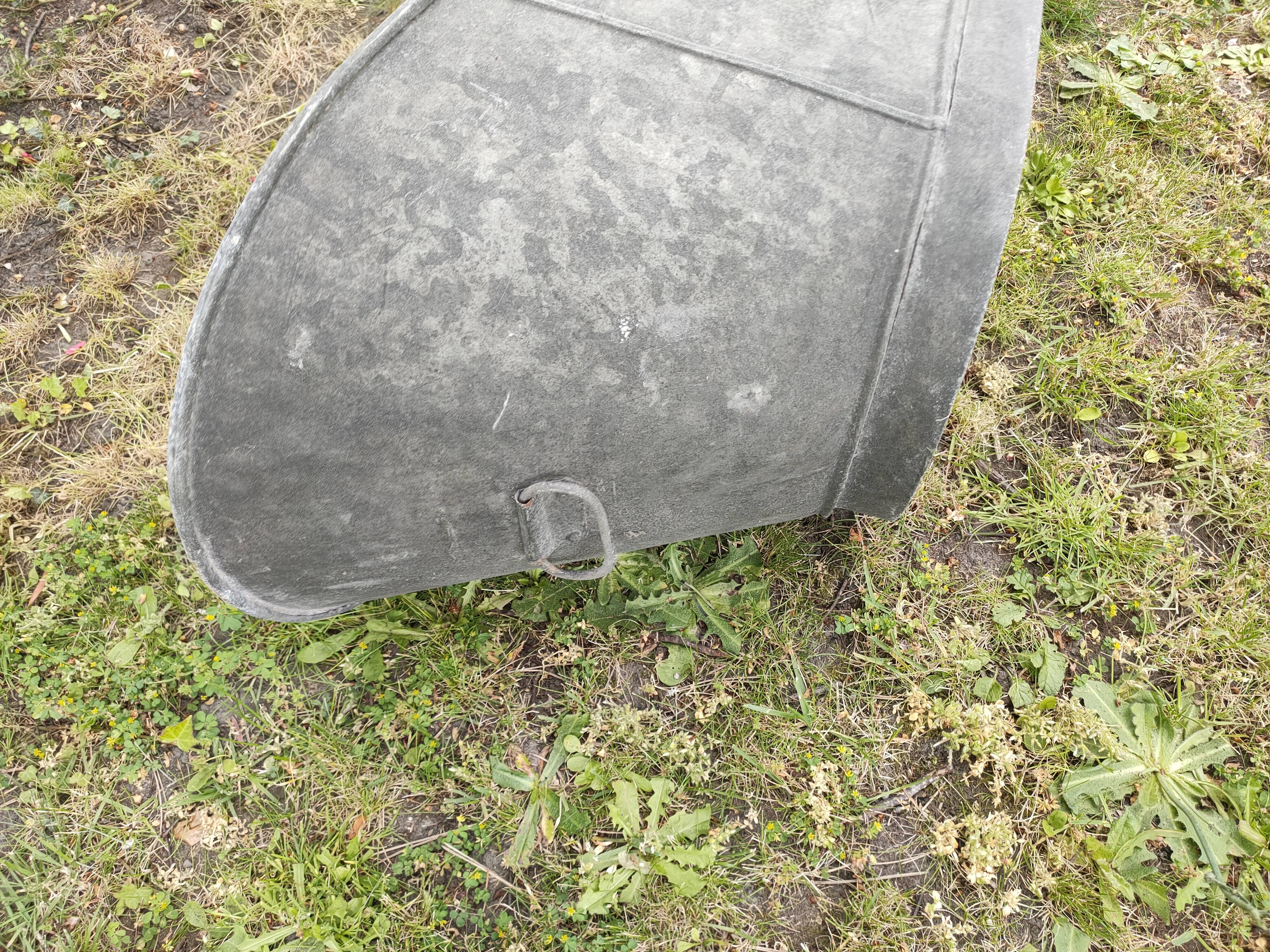 Antique children's bathtub in zinc