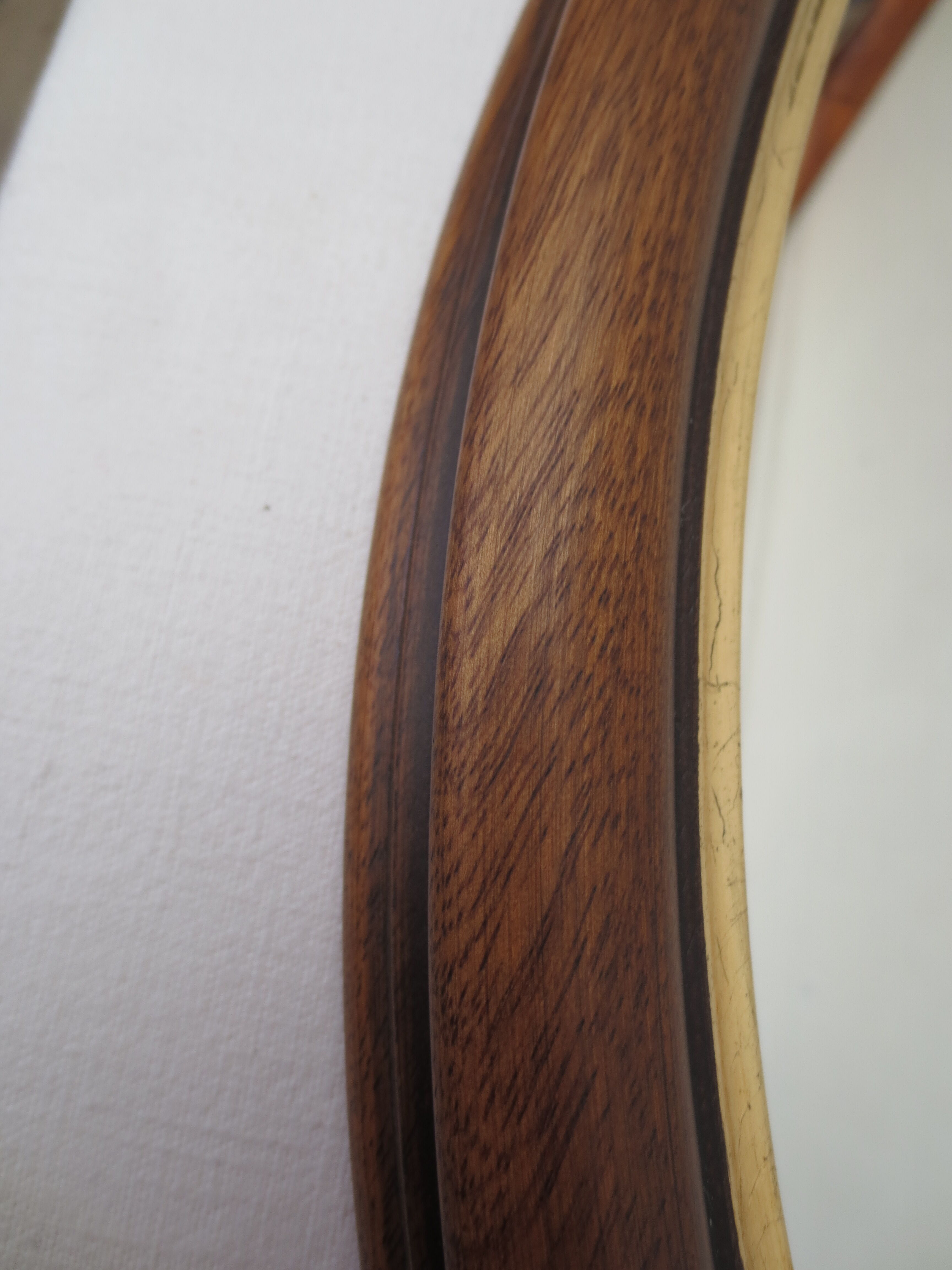 Old oval mirror, walnut wood tower, gilded border