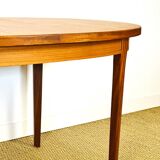 Oval teak dining table with extension