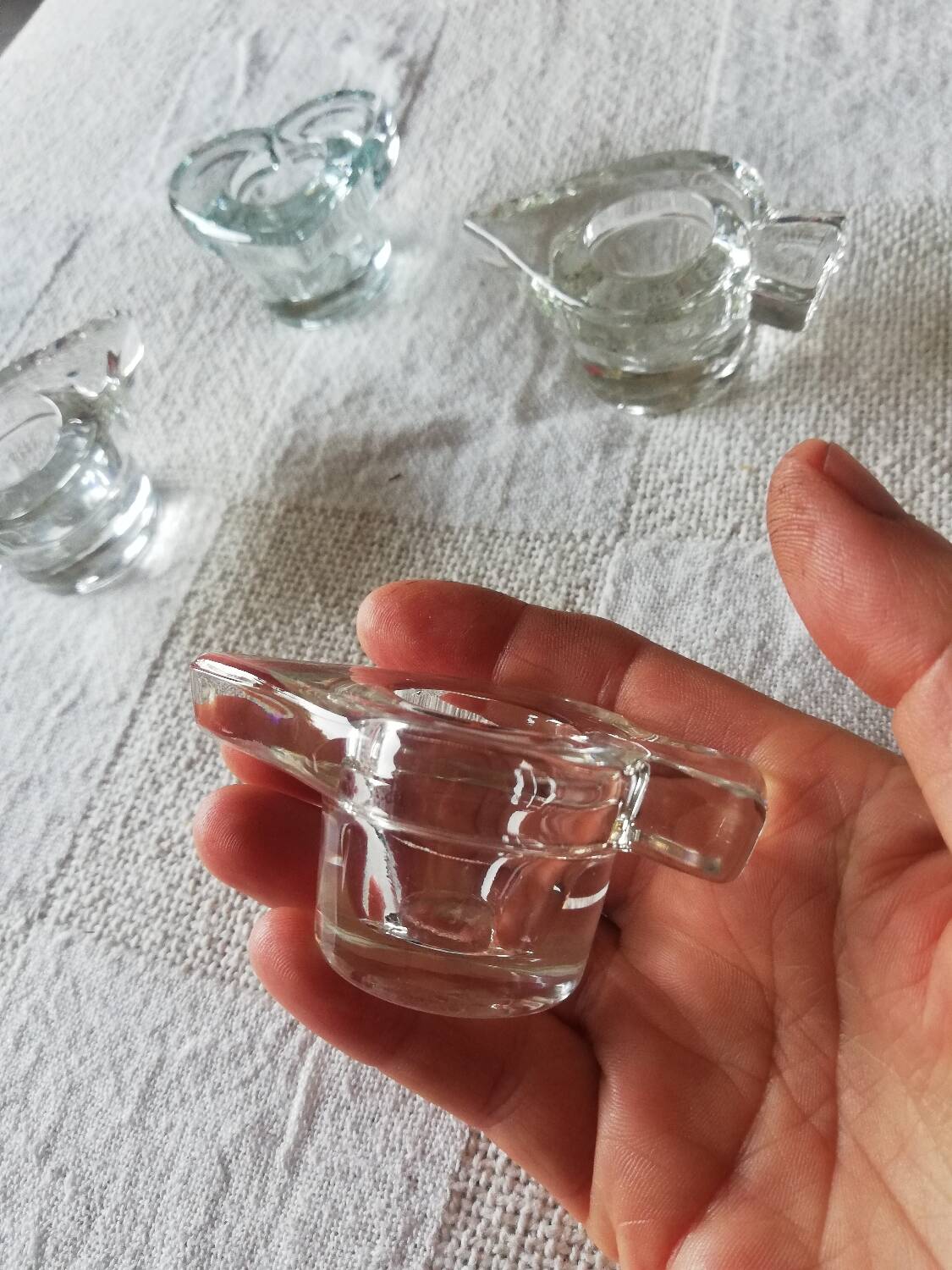 Set of four small transparent glass candle holders 3 spikes 1 heart