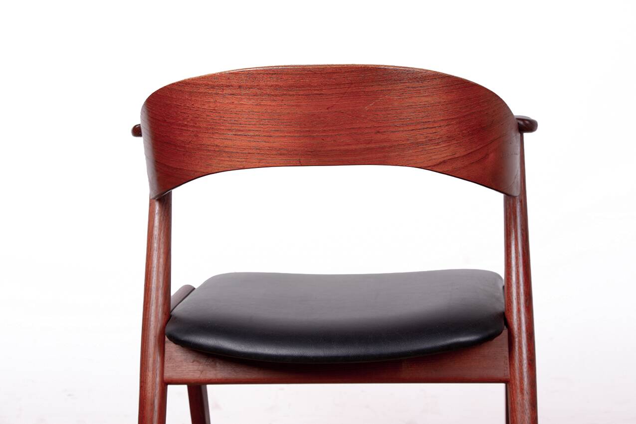 Danish armchair in teak and Skai, by Henning Kjaernulf for Korup Stolefabr.