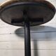 Bistro standing table with marble top and cast iron base.