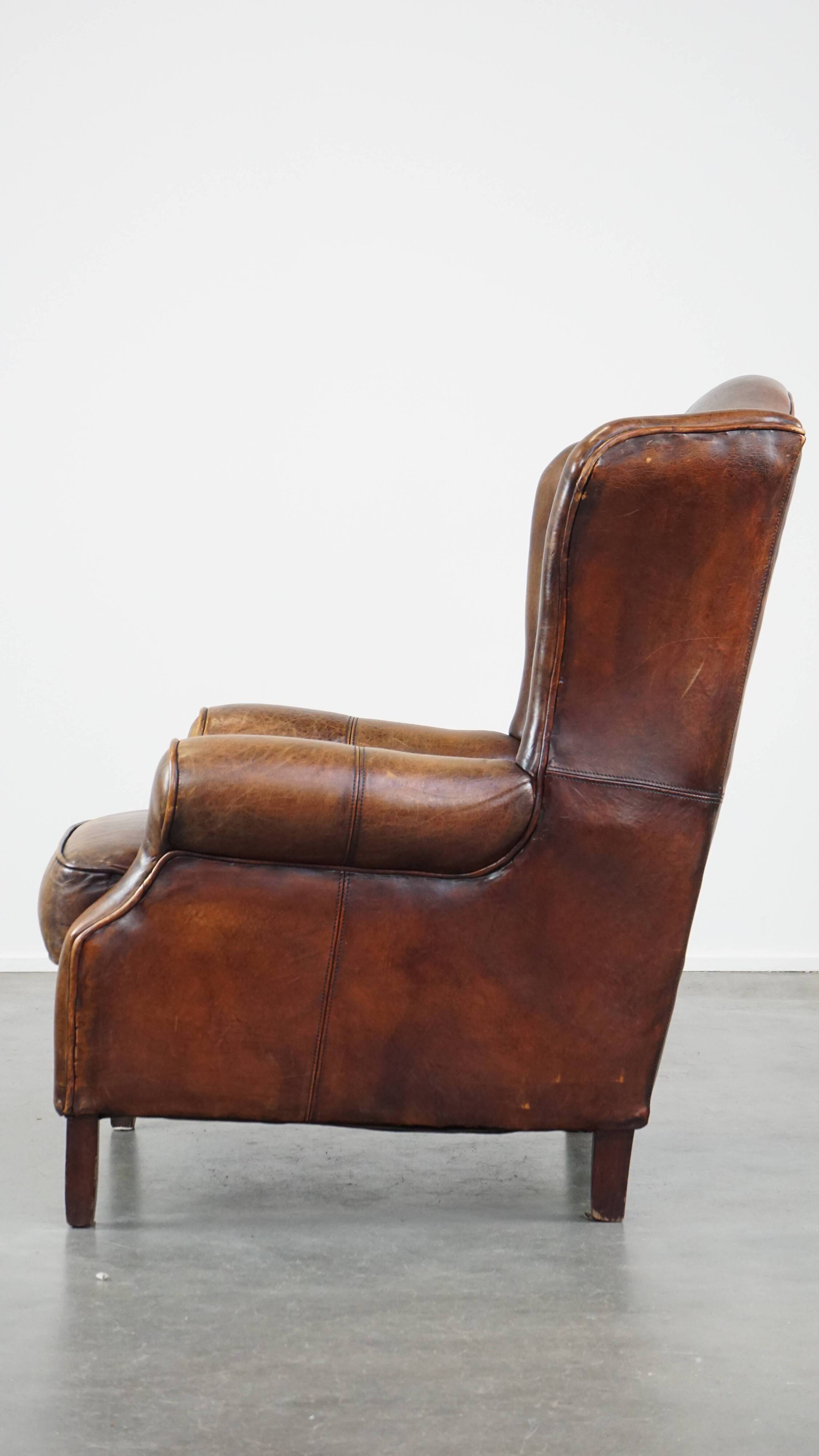 Fauteuil à oreilles en cuir de mouton
