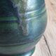 Vintage ceramic pitcher vase in glazed green and blue.