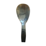 Rice spoon covered with serving in Asian handicraft horn