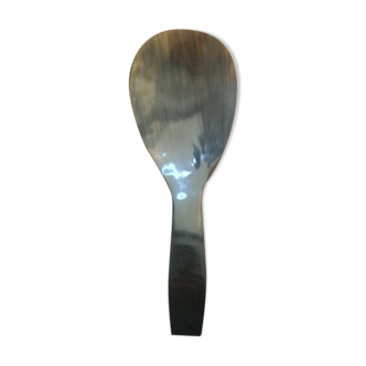 Rice spoon covered with serving in Asian handicraft horn