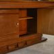 Solid oak table with central pedestal base and storage, Charles Dudouyt, 1950s