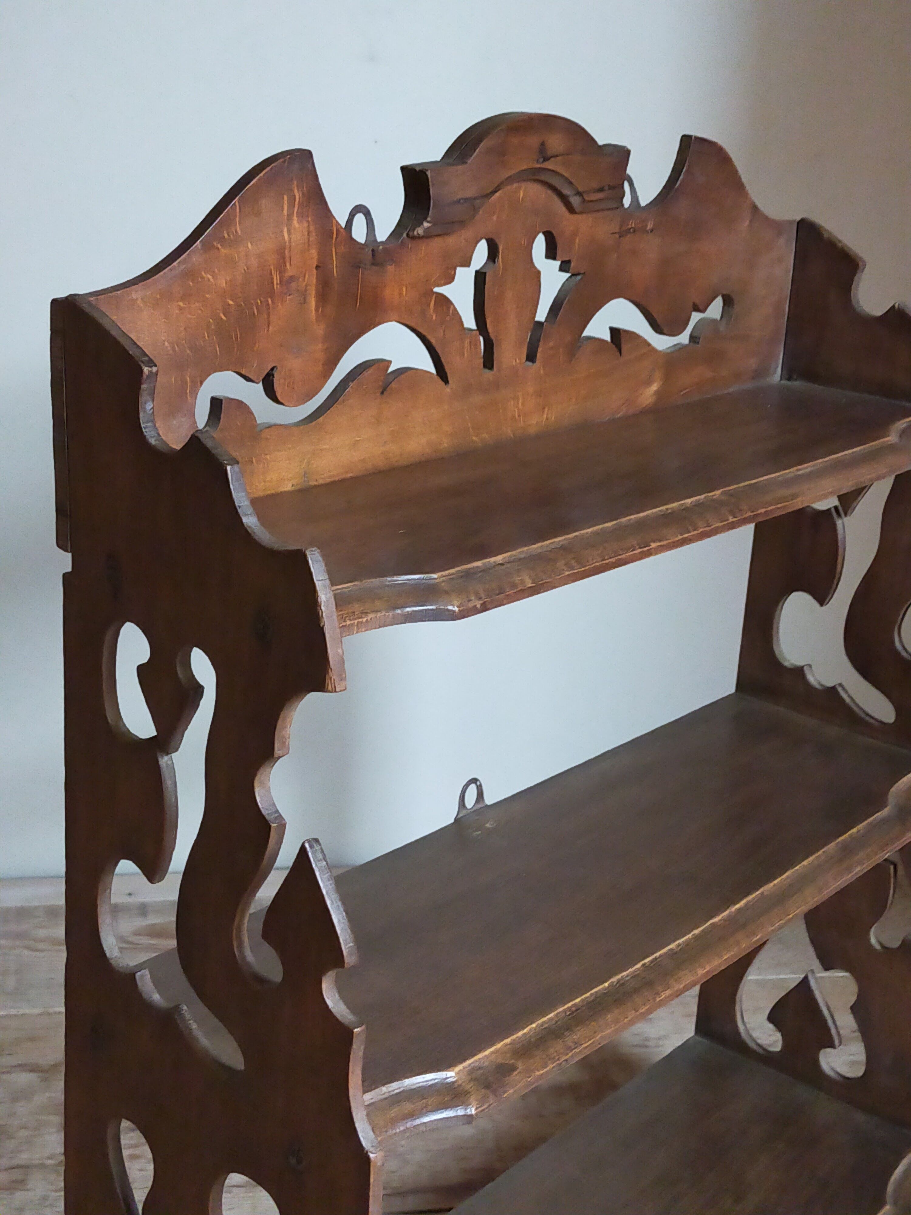 Old carved wooden wall shelf