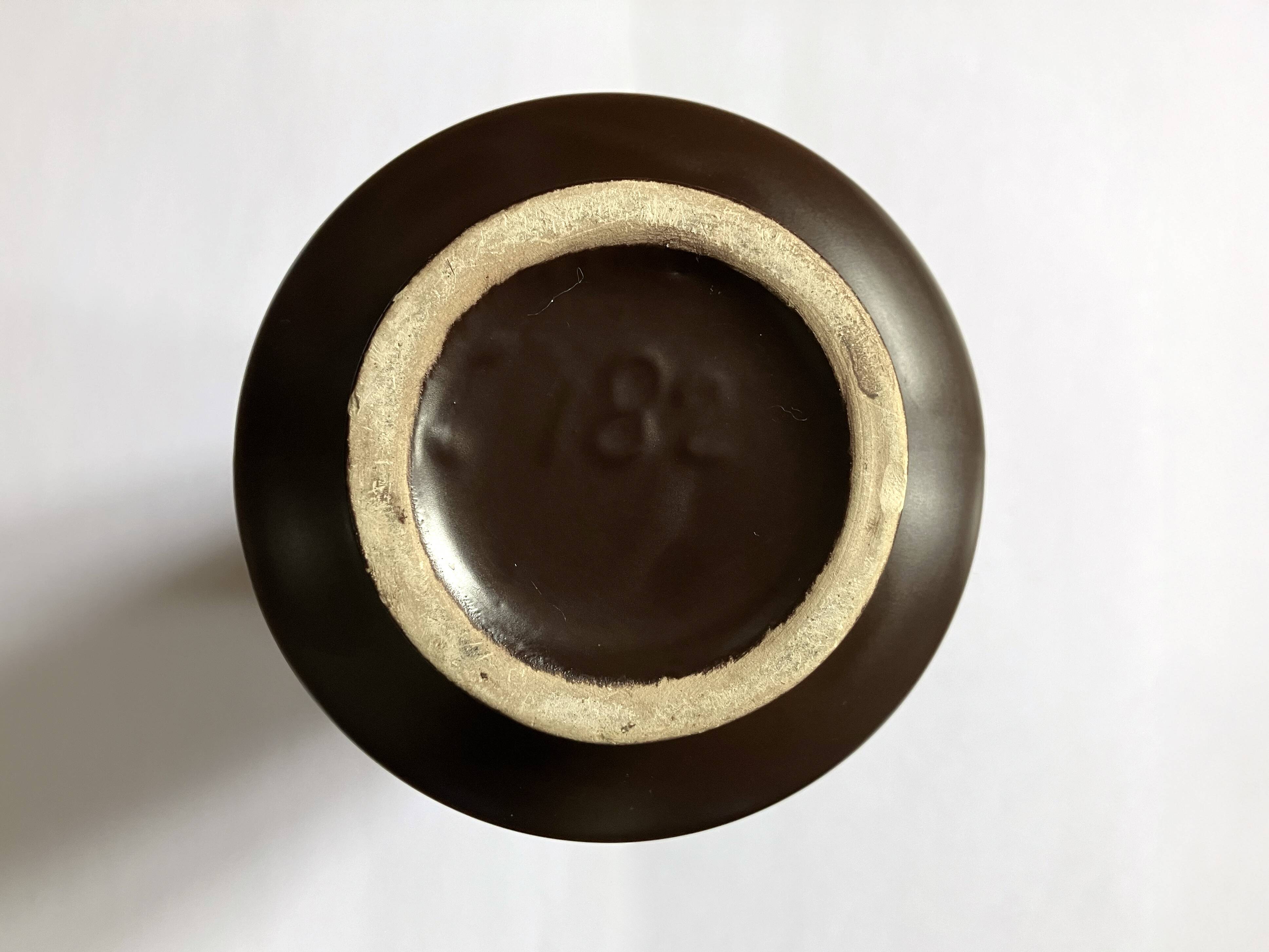 Brown and orange ceramic vase • 1970