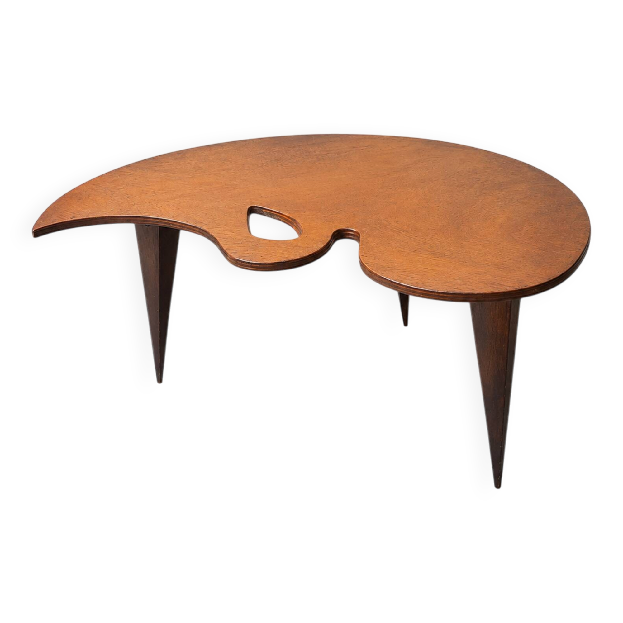 Mid-century coffee table with a palette shape and splayed legs.