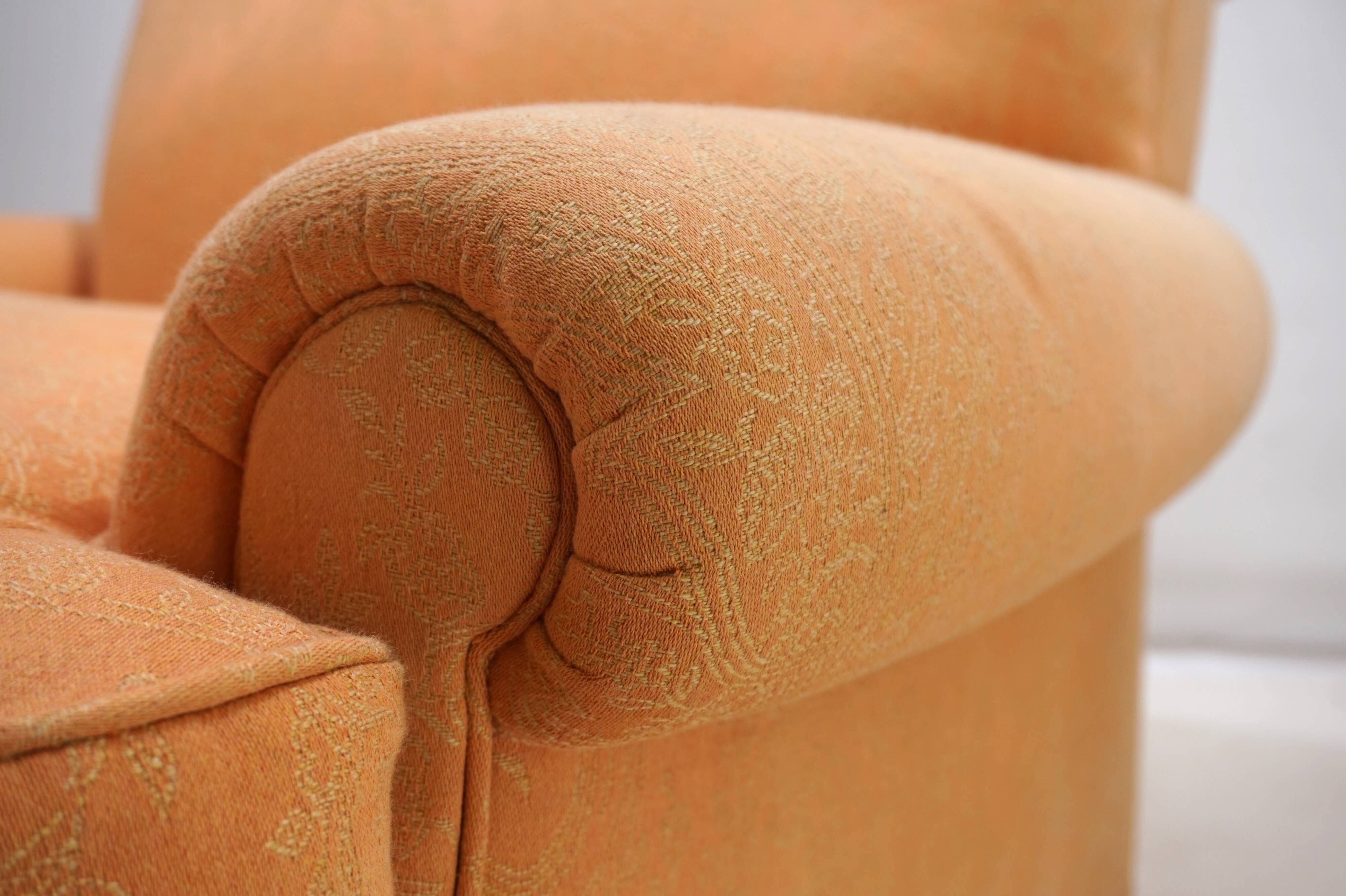 Deep seated armchair in the style of Howard & Sons