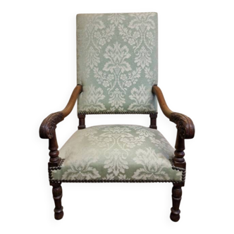Antique Louis XIV style armchair in moulded wood and damask-style fabric.