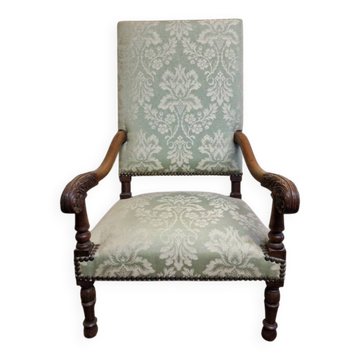 Antique Louis XIV style armchair in moulded wood and damask-style fabric.
