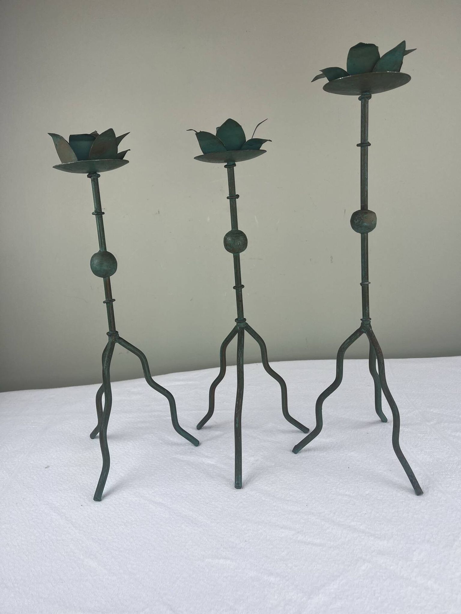Sculptural candle holder trio