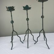 Sculptural candle holder trio