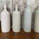 Set of 4 Old Grey Stoneware Bottles + Vintage Porcelain Stopper