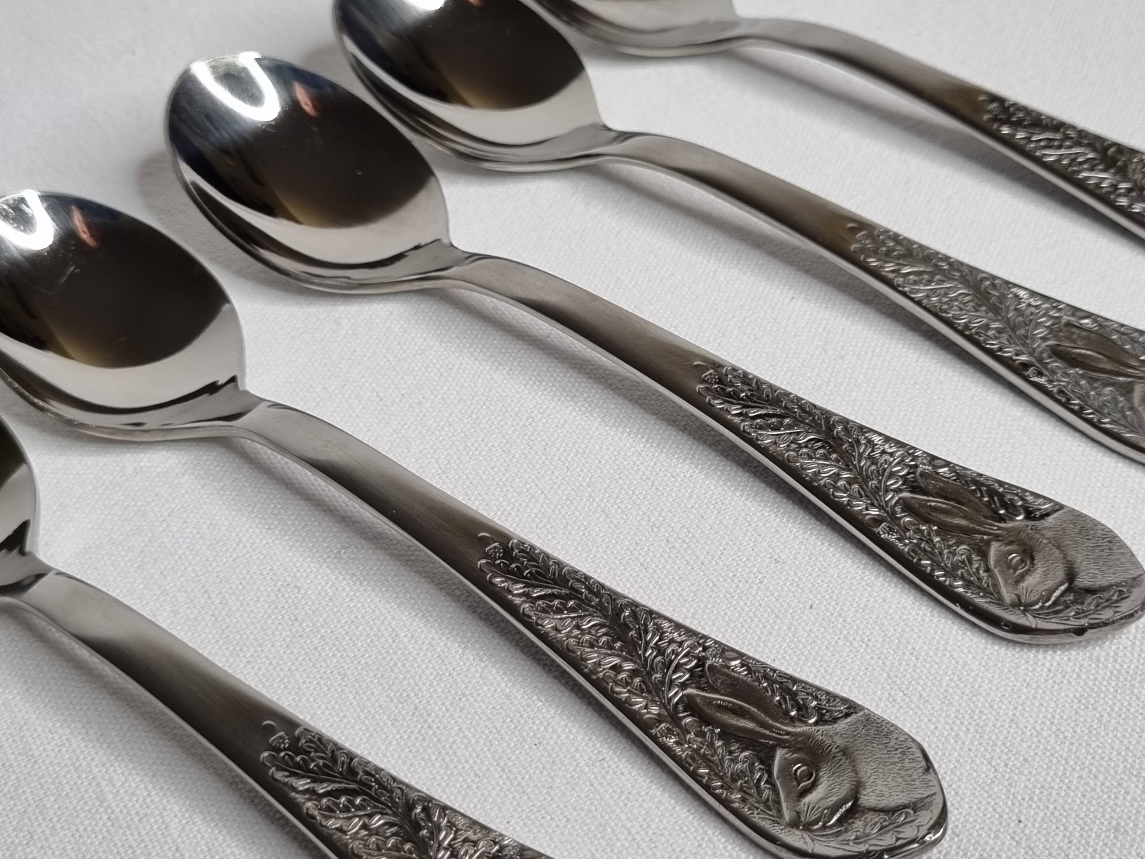 Set of six "Burgsil" stainless steel teaspoons with rabbit decoration