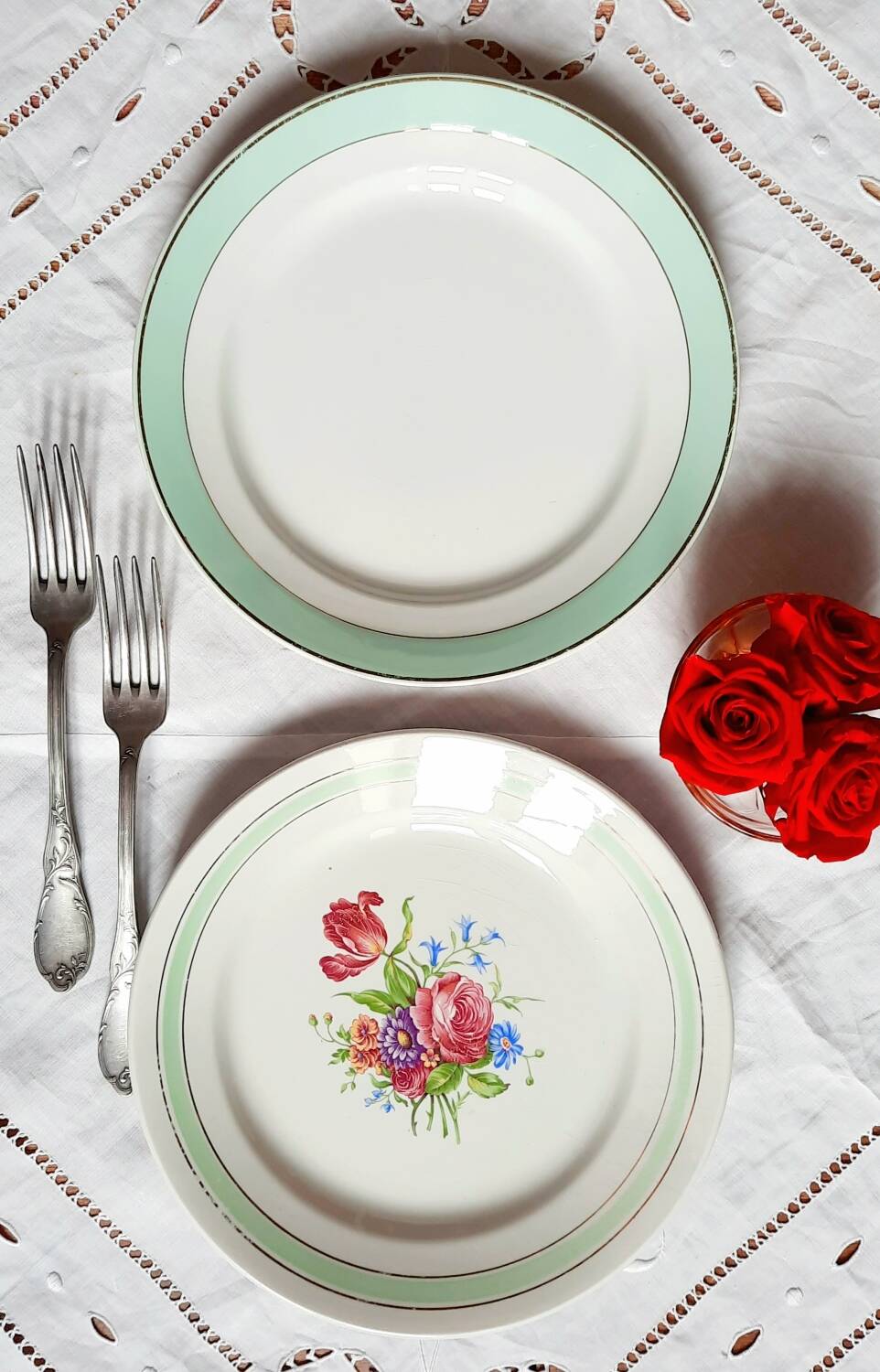 Old mismatched earthenware dinner plates accompanied by a deep dish