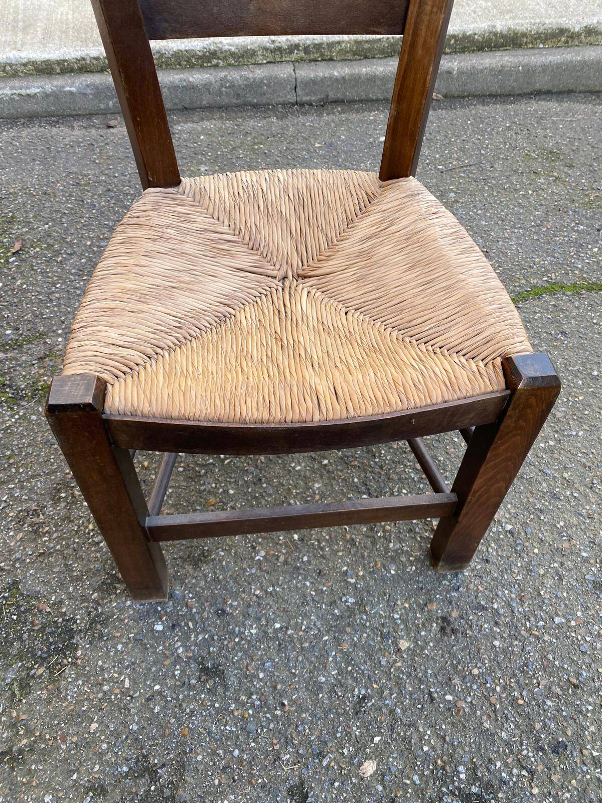 Solid wood chair in dark oak with rush seating, Louis Philippe style.