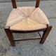 Solid wood chair in dark oak with rush seating, Louis Philippe style.