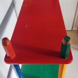 Shelf on legs, library, crayons in 4 colours.