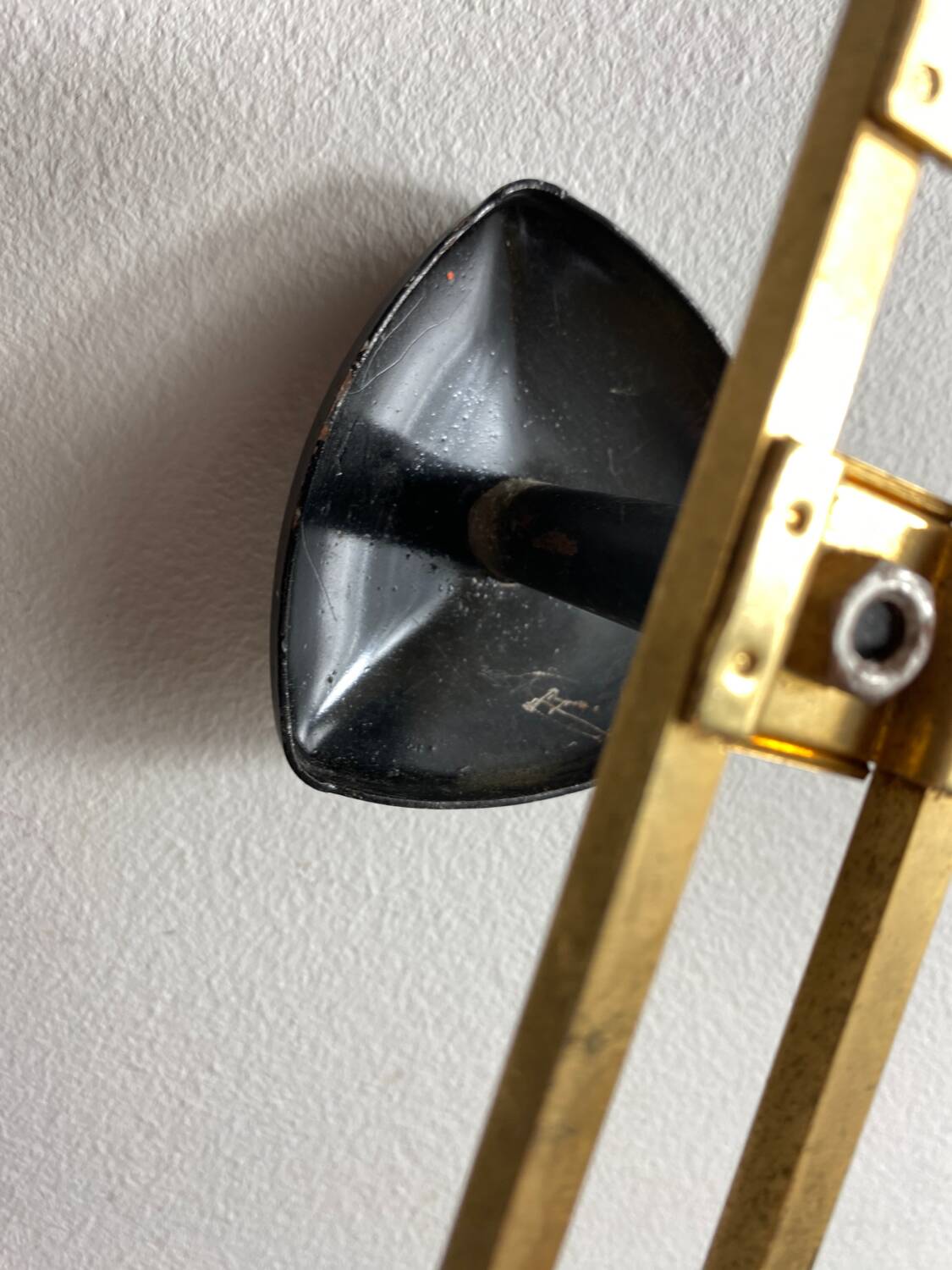 Wall-mounted coat rack with 3 hooks from the 1960s.