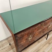 Mid-century mahogany buffet with teal glass and compartments with a drawer.