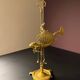 Antique brass oil lamp with fish decoration – marine object – cabinet