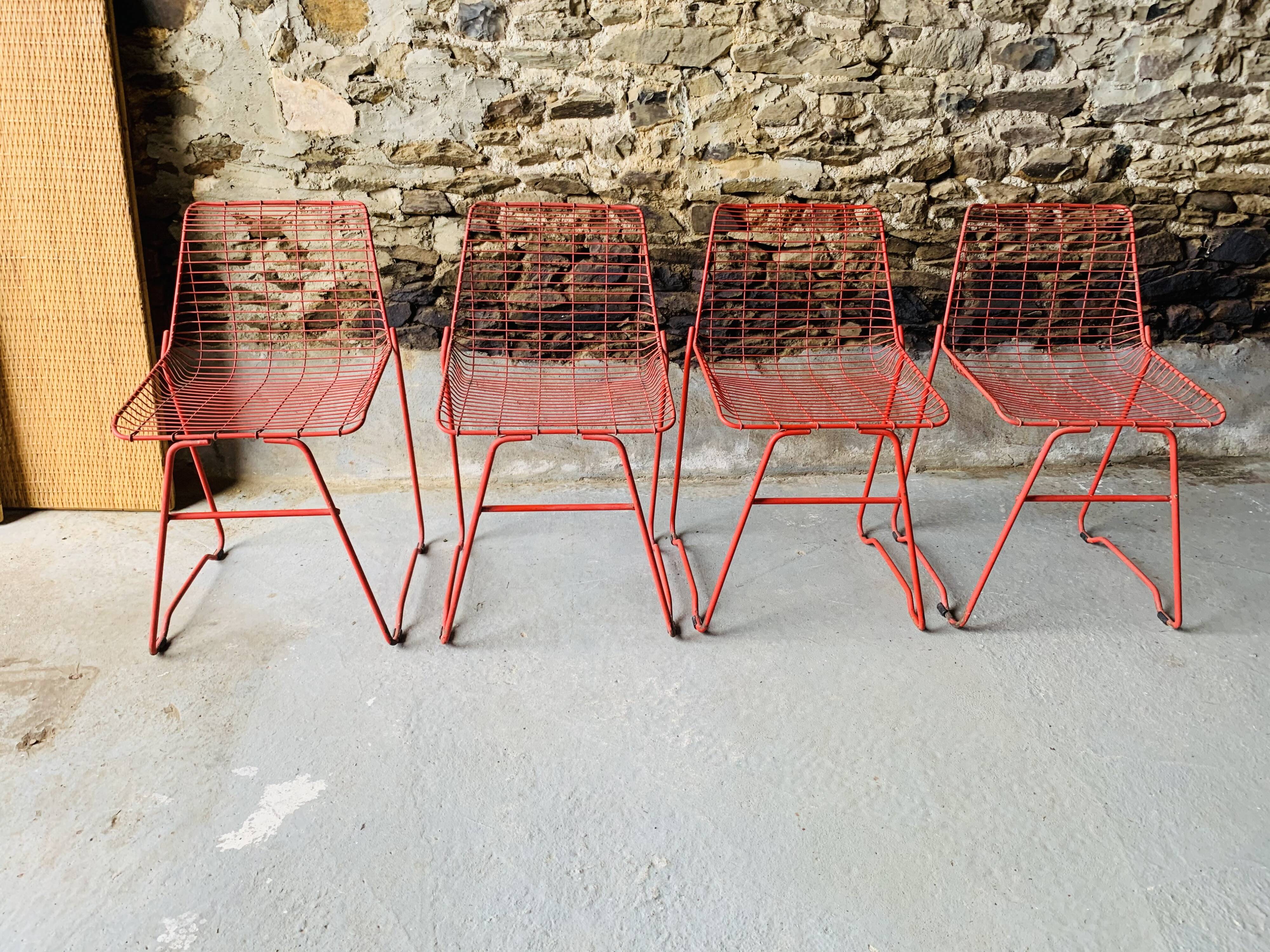 4 red design chairs