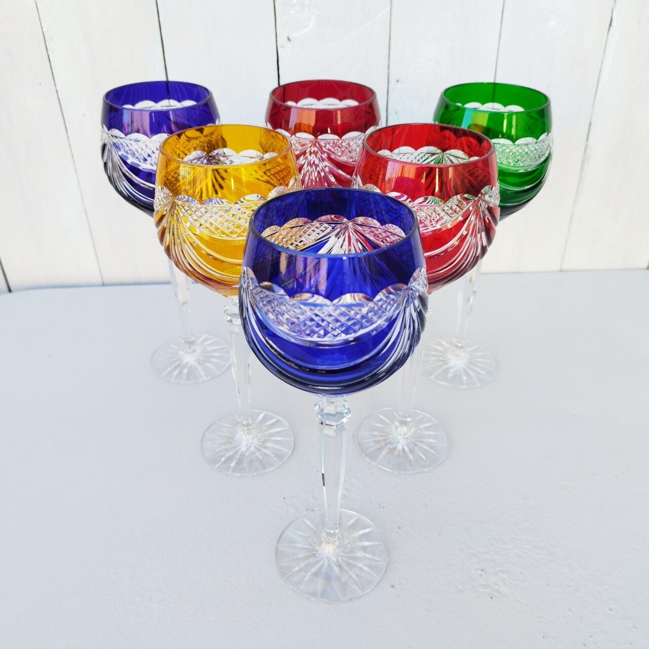 Six vintage coloured cut crystal wine glasses